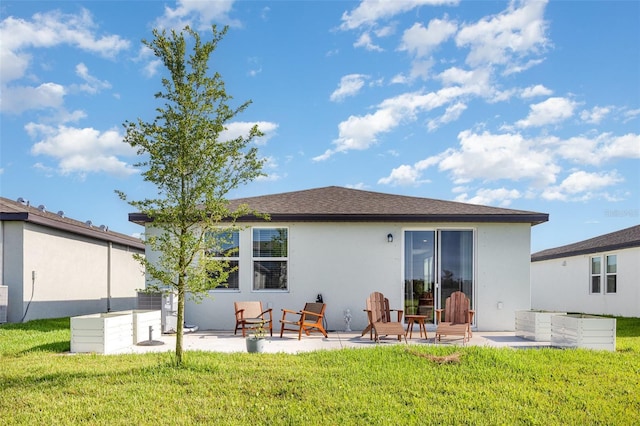 13958 Richland Gulf Cir, Parrish, FL 34219 - back of house with stucco siding, a patio area, and a yard