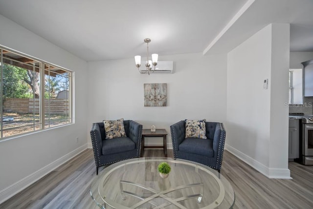 12304 Woodleigh Ave, Tampa, FL 33612 - sitting room with wood finished floors, baseboards, and a chandelier