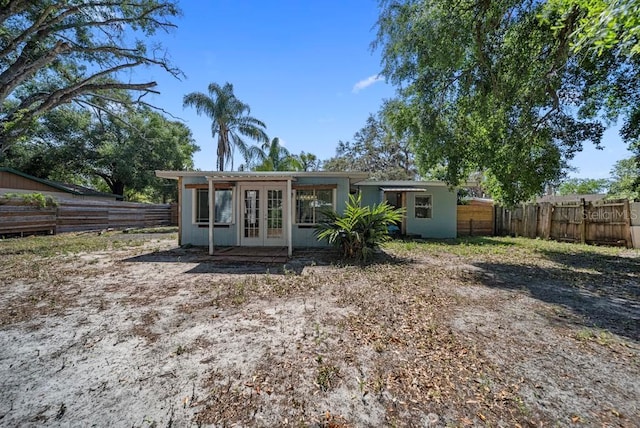 12304 Woodleigh Ave, Tampa, FL 33612 - rear view of property with french doors and a fenced backyard