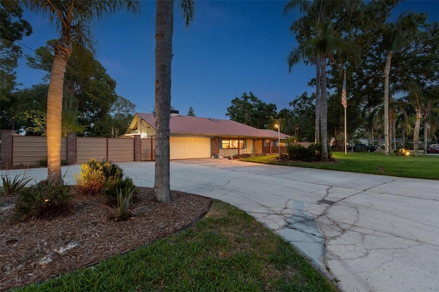 7507 Beasley Rd, Tampa, FL 33615 - view of front of property with driveway and a garage