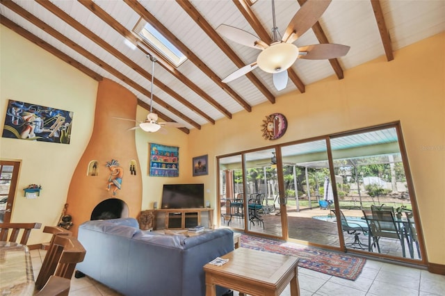 7507 Beasley Rd, Tampa, FL 33615 - living room with ceiling fan, beam ceiling, light tile patterned floors, high vaulted ceiling, and plenty of natural light