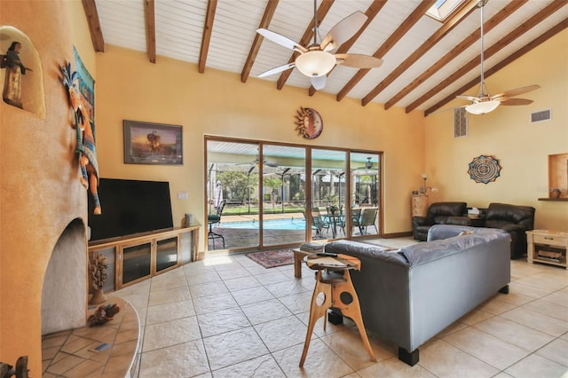 7507 Beasley Rd, Tampa, FL 33615 - living room with a ceiling fan, high vaulted ceiling, beamed ceiling, a fireplace, and light tile patterned floors