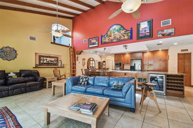 7507 Beasley Rd, Tampa, FL 33615 - living room featuring ceiling fan, wine cooler, high vaulted ceiling, light tile patterned floors, and wood ceiling with exposed beams