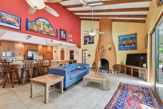 7507 Beasley Rd, Tampa, FL 33615 - living area featuring ceiling fan, light tile patterned flooring, beamed ceiling, and high vaulted ceiling