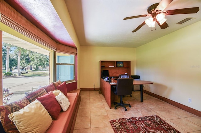 7507 Beasley Rd, Tampa, FL 33615 - office area featuring baseboards, lofted ceiling, ceiling fan, and light tile patterned flooring