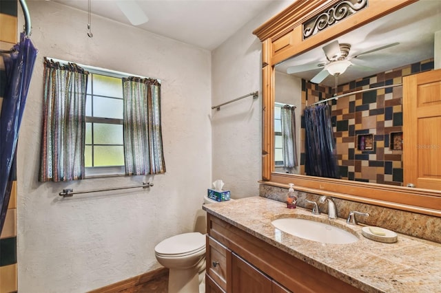 7507 Beasley Rd, Tampa, FL 33615 - bathroom featuring a ceiling fan, vanity, toilet, a shower with shower curtain, and a textured wall
