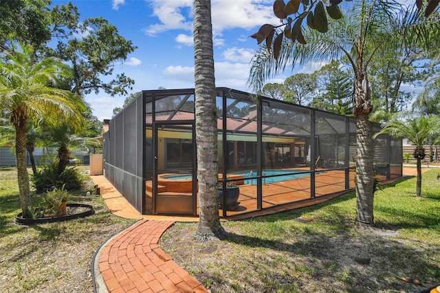 7507 Beasley Rd, Tampa, FL 33615 - back of house with an outdoor pool and a lanai