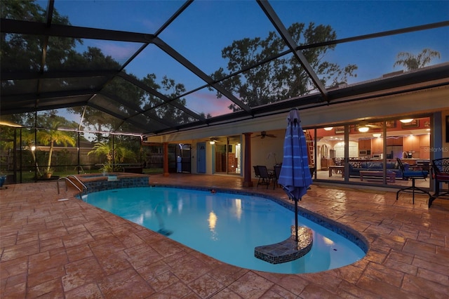 7507 Beasley Rd, Tampa, FL 33615 - view of swimming pool with a patio, a ceiling fan, a pool with connected hot tub, and glass enclosure