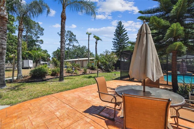 7507 Beasley Rd, Tampa, FL 33615 - view of patio featuring outdoor dining space and a lanai