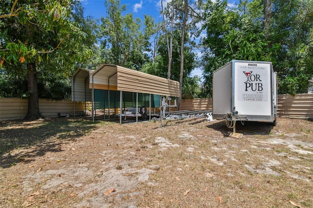 7507 Beasley Rd, Tampa, FL 33615 - view of parking / parking lot featuring a carport