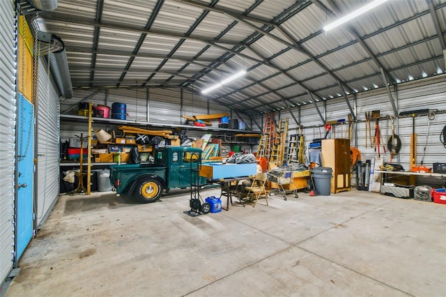 7507 Beasley Rd, Tampa, FL 33615 - garage with metal wall and a workshop area