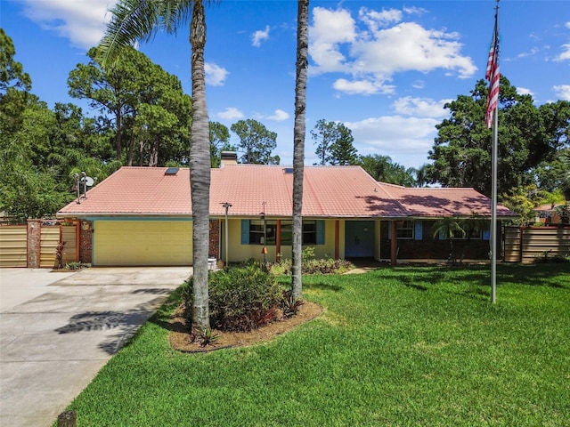 7507 Beasley Rd, Tampa, FL 33615 - single story home with a garage, driveway, a chimney, and a tile roof