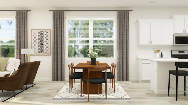 12597 Lily Quartz Loop, Parrish, FL 34219 - dining space featuring light wood-style floors and baseboards