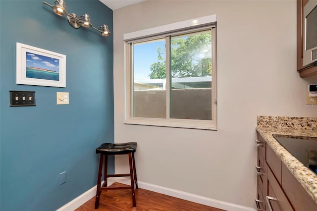2444 Laurelwood Dr Unit A, Clearwater, FL 33763 - dining area featuring wood finished floors and baseboards