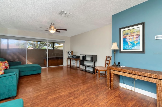 2444 Laurelwood Dr Unit A, Clearwater, FL 33763 - living room featuring wood finished floors, ceiling fan, and a textured ceiling