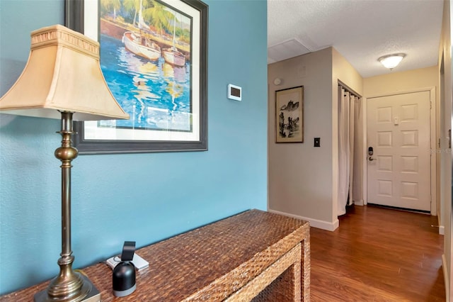2444 Laurelwood Dr Unit A, Clearwater, FL 33763 - corridor featuring wood finished floors, a textured ceiling, and baseboards