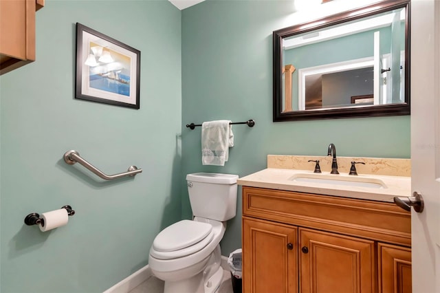 2444 Laurelwood Dr Unit A, Clearwater, FL 33763 - bathroom with toilet, vanity, and baseboards