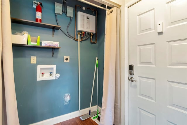 2444 Laurelwood Dr Unit A, Clearwater, FL 33763 - washroom with washer hookup, hookup for an electric dryer, baseboards, and dark wood-style flooring