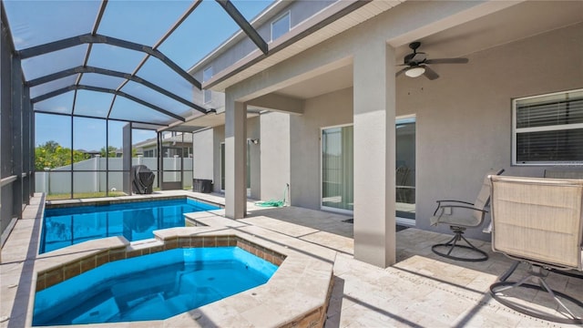 3862 Tristram Loop, Land O Lakes, FL 34638 - view of pool featuring a patio area, a ceiling fan, glass enclosure, and a pool with connected hot tub
