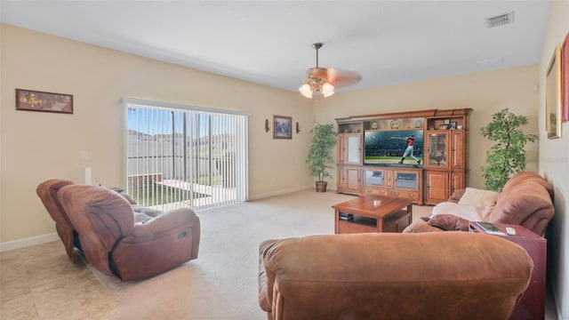 3862 Tristram Loop, Land O Lakes, FL 34638 - living area featuring a ceiling fan and baseboards