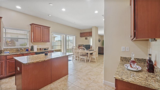 3862 Tristram Loop, Land O Lakes, FL 34638 - kitchen with a sink, light stone countertops, a center island, recessed lighting, and light tile patterned floors