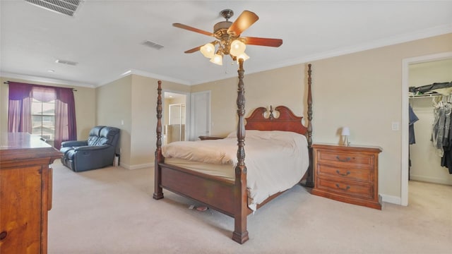 3862 Tristram Loop, Land O Lakes, FL 34638 - carpeted bedroom with a walk in closet, baseboards, ornamental molding, a closet, and a ceiling fan