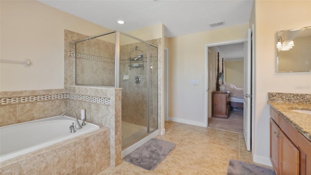 3862 Tristram Loop, Land O Lakes, FL 34638 - full bath featuring vanity, a bath, a stall shower, and tile patterned flooring
