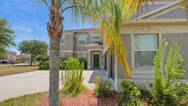 3862 Tristram Loop, Land O Lakes, FL 34638 - view of front of home featuring stucco siding