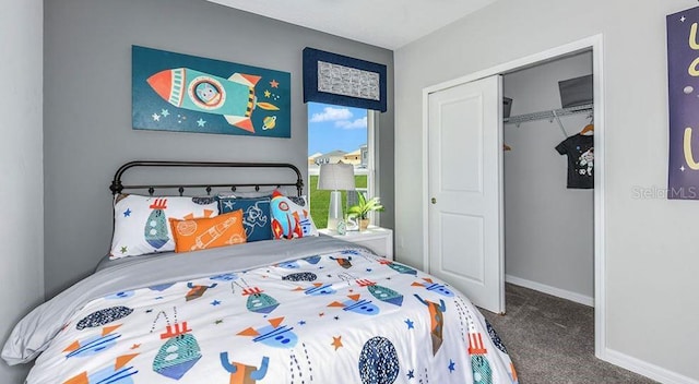 12469 Gust Ct, Hudson, FL 34669 - bedroom featuring carpet floors, a closet, and baseboards