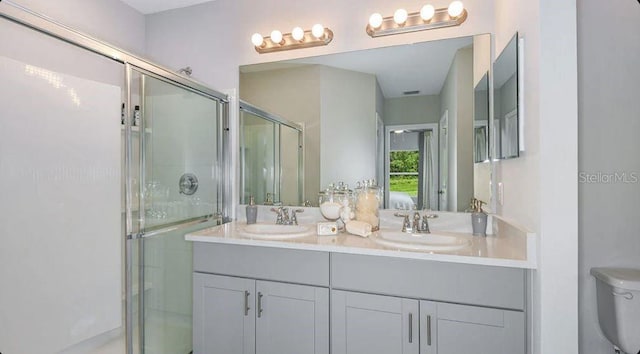 12469 Gust Ct, Hudson, FL 34669 - full bath featuring double vanity, a stall shower, and toilet