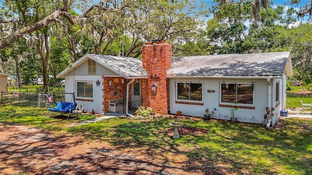 11912 Mcmullen Loop, Riverview, FL 33569 - view of front facade featuring a chimney and a shingled roof