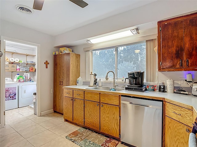 11912 Mcmullen Loop, Riverview, FL 33569 - kitchen with stainless steel dishwasher, a sink, washer and dryer, and light countertops