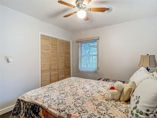 11912 Mcmullen Loop, Riverview, FL 33569 - bedroom with a closet, a ceiling fan, and baseboards