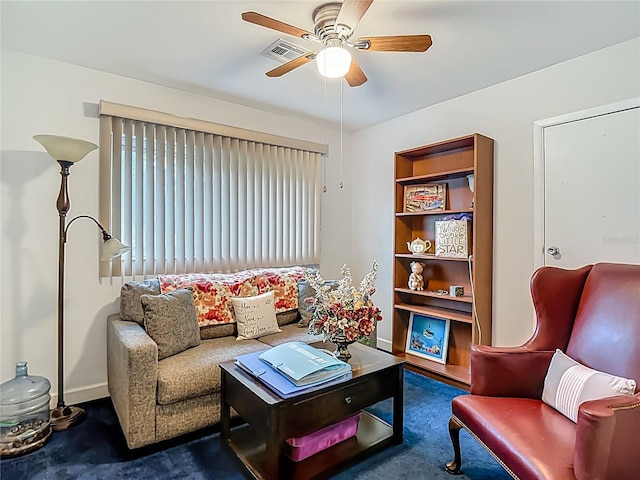 11912 Mcmullen Loop, Riverview, FL 33569 - living room featuring carpet floors, a ceiling fan, and baseboards