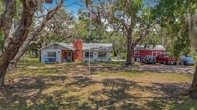 11912 Mcmullen Loop, Riverview, FL 33569 - view of front of home featuring a chimney
