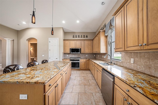 10645 Ruffino Ct, Trinity, FL 34655 - kitchen featuring appliances with stainless steel finishes, a sink, arched walkways, light stone countertops, and decorative backsplash