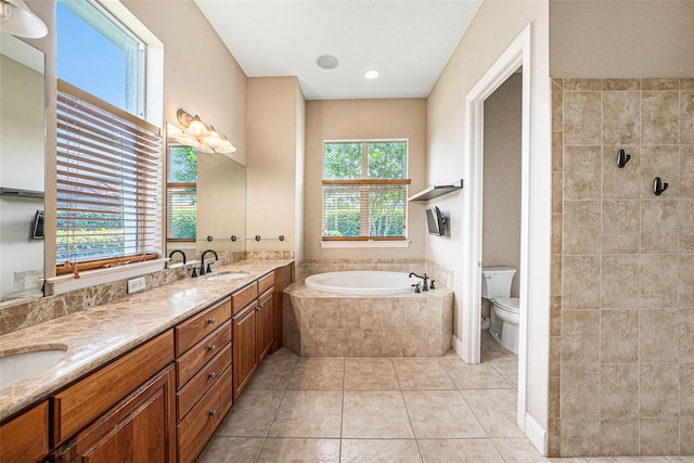 10645 Ruffino Ct, Trinity, FL 34655 - full bathroom with a bath, toilet, double vanity, and tile patterned floors