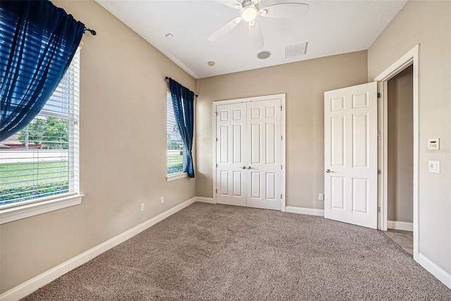 10645 Ruffino Ct, Trinity, FL 34655 - unfurnished bedroom featuring carpet floors, a closet, and baseboards