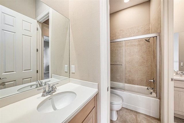 10645 Ruffino Ct, Trinity, FL 34655 - bathroom with toilet, vanity, enclosed tub / shower combo, and tile patterned flooring