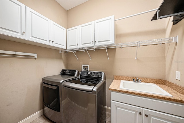 10645 Ruffino Ct, Trinity, FL 34655 - laundry area with washing machine and dryer, cabinet space, and baseboards