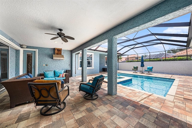 10645 Ruffino Ct, Trinity, FL 34655 - view of swimming pool with ceiling fan, an outdoor hangout area, a patio, a pool with connected hot tub, and glass enclosure