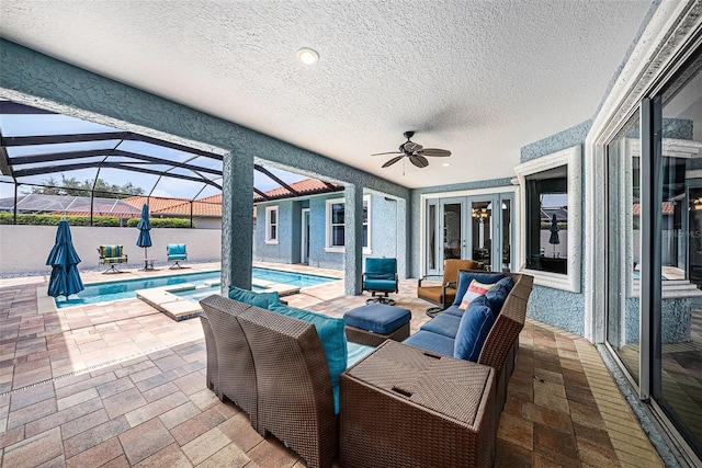 10645 Ruffino Ct, Trinity, FL 34655 - view of patio / terrace with ceiling fan, glass enclosure, an outdoor living space, french doors, and a pool with connected hot tub