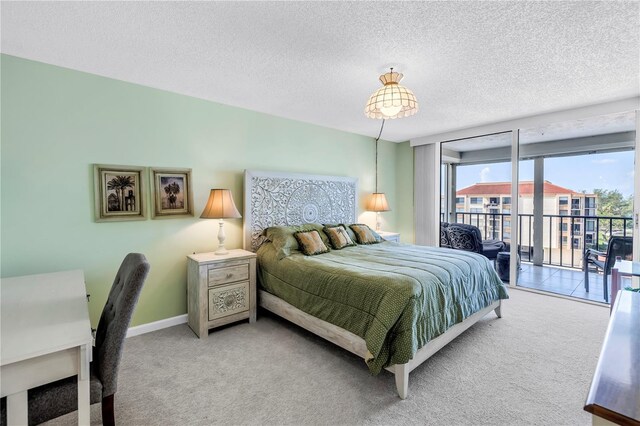 6265 Sun Blvd Unit 605, Saint Petersburg, FL 33715 - carpeted bedroom with access to exterior, a textured ceiling, and baseboards