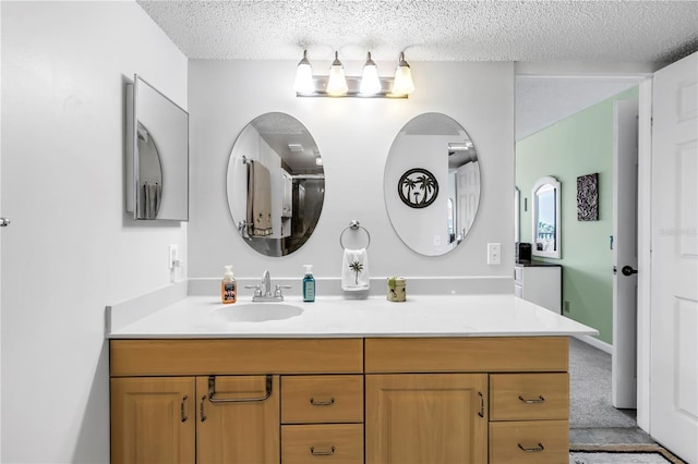 6265 Sun Blvd Unit 605, Saint Petersburg, FL 33715 - bathroom with vanity and a textured ceiling