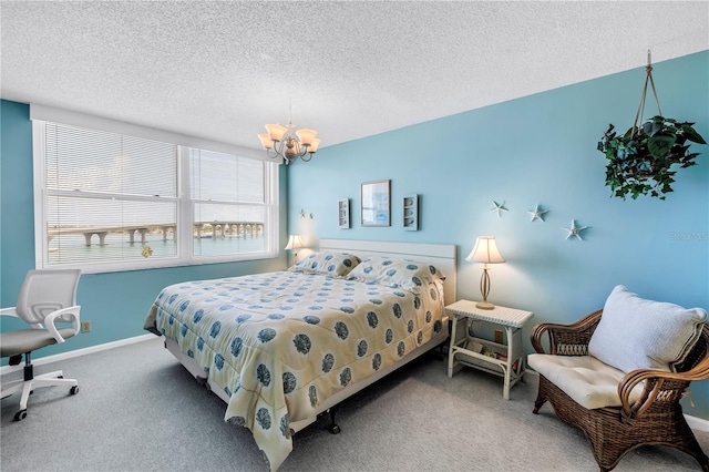 6265 Sun Blvd Unit 605, Saint Petersburg, FL 33715 - carpeted bedroom with a chandelier, a textured ceiling, and baseboards