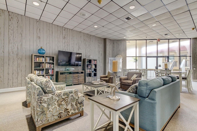 6265 Sun Blvd Unit 605, Saint Petersburg, FL 33715 - living room featuring carpet flooring, recessed lighting, expansive windows, and wooden walls