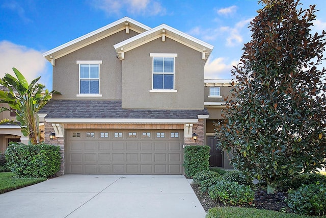 16016 Persimmon Grove Dr, Lithia, FL 33547 - traditional-style home featuring stone siding, stucco siding, driveway, and an attached garage