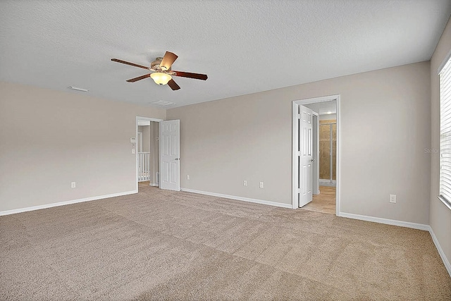 16016 Persimmon Grove Dr, Lithia, FL 33547 - empty room with ceiling fan, light carpet, baseboards, and a textured ceiling