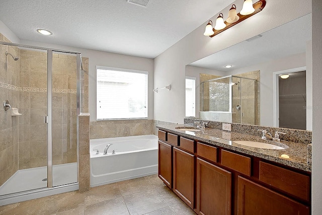 16016 Persimmon Grove Dr, Lithia, FL 33547 - bathroom featuring a stall shower, a garden tub, double vanity, a walk in closet, and tile patterned floors