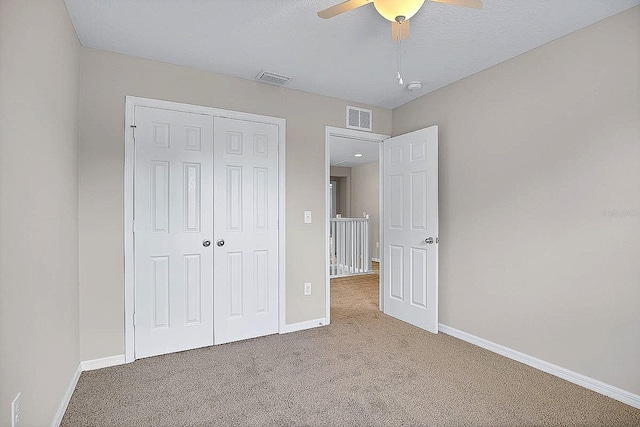 16016 Persimmon Grove Dr, Lithia, FL 33547 - unfurnished bedroom with carpet, a closet, baseboards, and a ceiling fan
